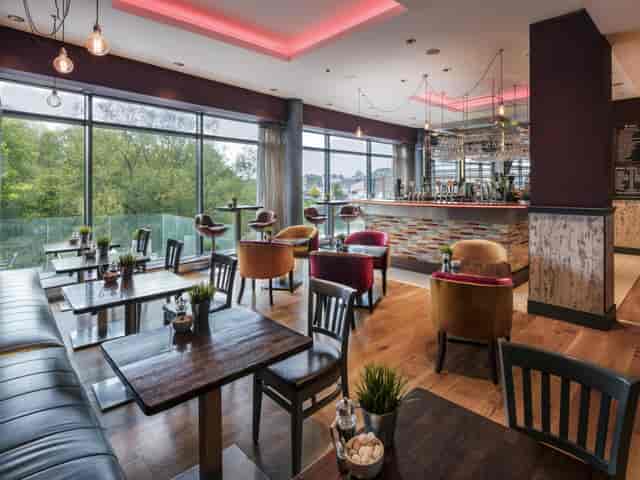 Stylish Absolute Hotel Limerick suite with modern decor for meetings and events.