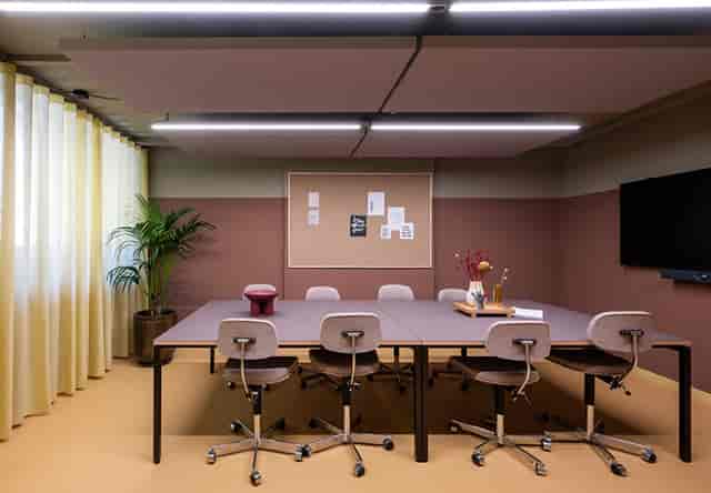 Modern conference room with ergonomic chairs, ideal for meetings and collaboration.