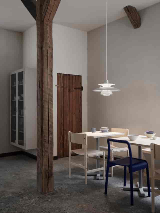 Minimalist dining area in BaneGaarden for intimate meetings and casual gatherings.