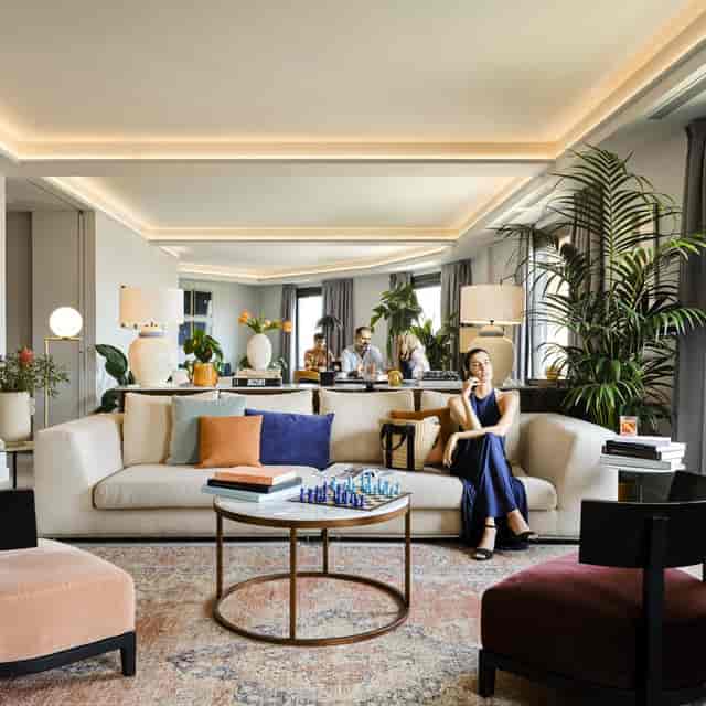 Stylish lounge for informal meetings with plush seating and ambient lighting.