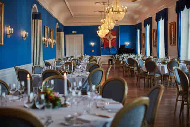 Elegant banquet hall with blue walls, perfect for formal events and galas.