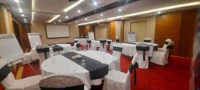 Premier meeting room in Ramada Lahore with round tables for workshops and conferences.