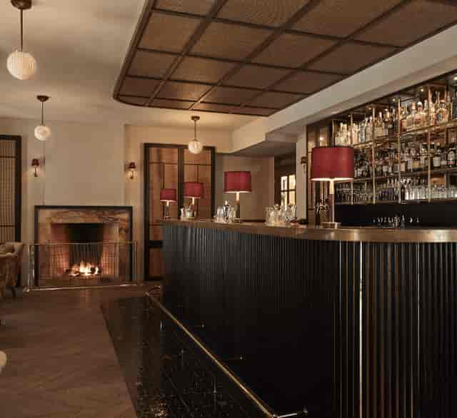 Stylish hotel bar with modern decor, ideal for cocktail receptions and networking events.