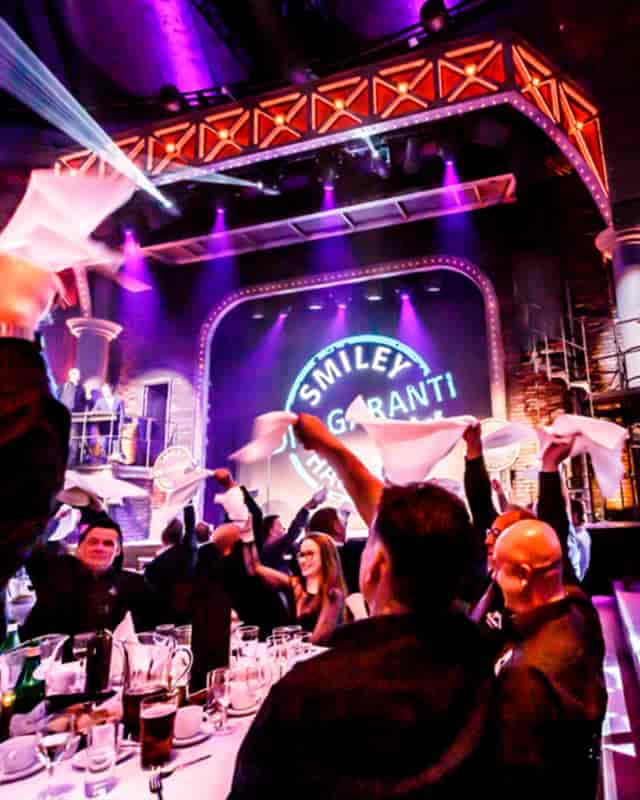 Lively corporate event at The Old Stables with festive ambiance and networking activities.