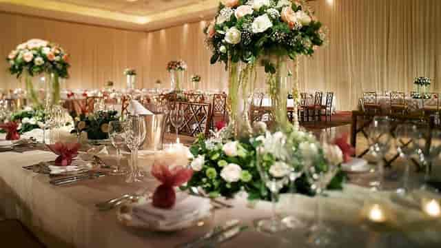 Ballroom at JW Marriott Jakarta with elegant floral centerpieces for weddings and events.
