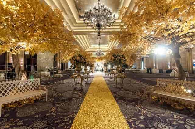 Kempinski Grand Ballroom, Jakarta: elegant space with autumn trees for weddings and celebrations.