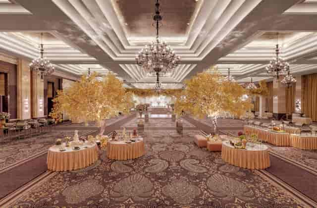 Elegant conference center with chandeliers, perfect for weddings and corporate events.