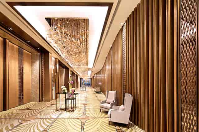 Java Ballroom at The Westin Jakarta: Elegant event space with wooden paneling for networking events.