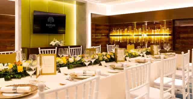Elegant meeting room in Raffles Jakarta, featuring a banquet table for corporate events.