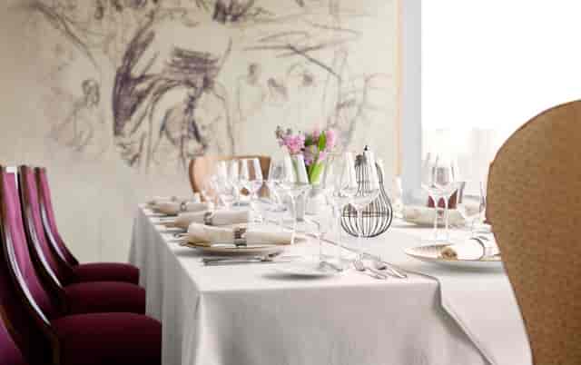 Elegant dining setup at Raffles Jakarta for formal gatherings and intimate dinners.