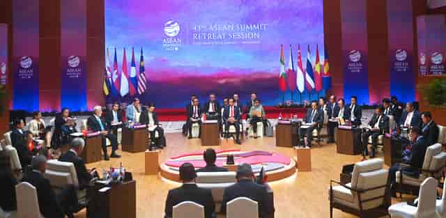 Main Conference Room at Jakarta Convention Center for ASEAN Summit, roundtable setup, collaboration.