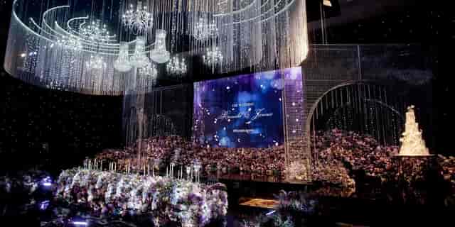 Grand Ballroom, Fairmont Jakarta: elegant stage with chandeliers for luxury weddings and galas.