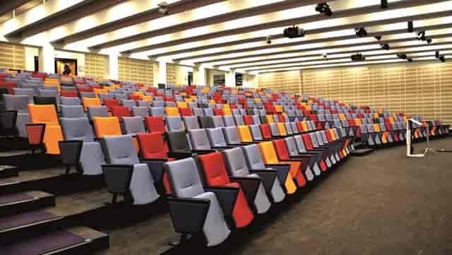 Modern auditorium with tiered seating, ideal for corporate events and conferences.