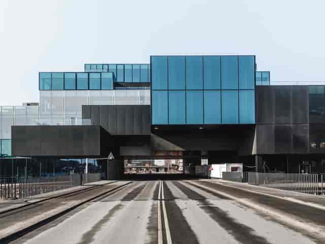 Modern conference room with glass elements, ideal for events and workshops.