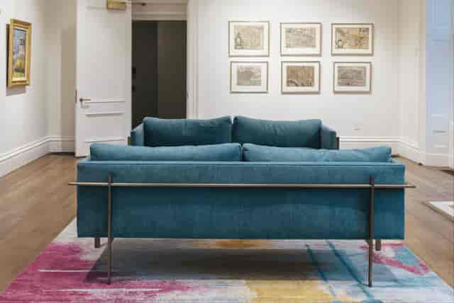 Stylish Lounge at French Library for Networking Events with Modern Couch and Vibrant Rug