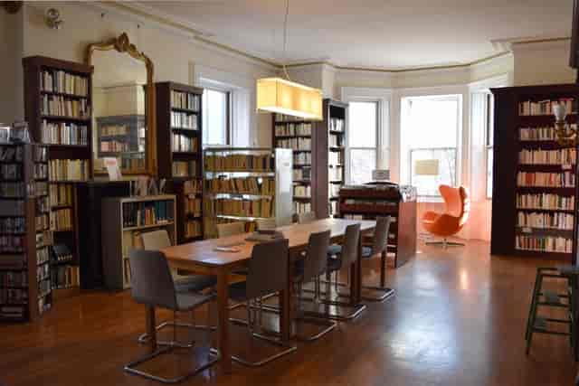 Reading Room in French Library, wooden table, ideal for meetings and brainstorming sessions.