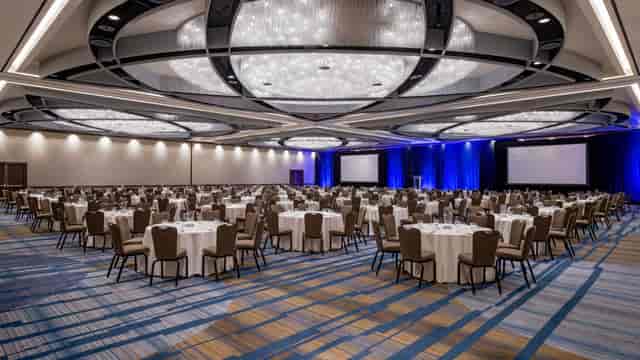 Grand Ballroom in SF Bold, elegant space with chandelier, ideal for conferences and banquets.