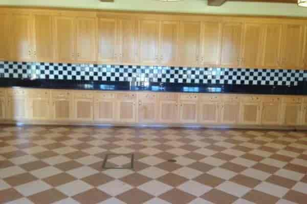 Spacious Moscone Recreation Center kitchen with checkered backsplash for catering events.