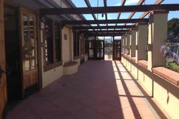 Community Room at Moscone Recreation Center, bright outdoor corridor for events and networking.