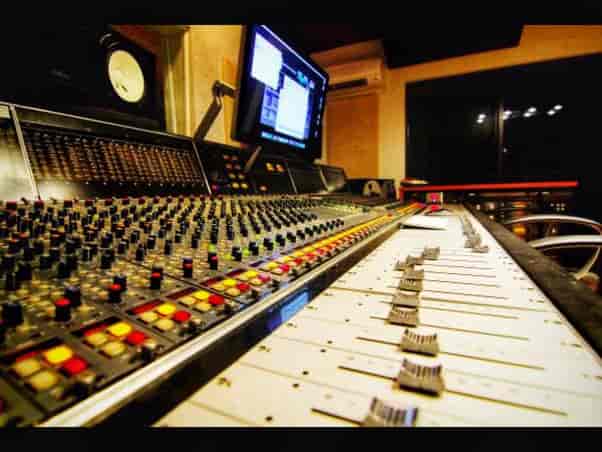 Professional audio mixing console in recording studio for events and presentations.