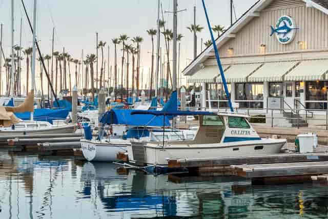 Bar at Bluewater Grill with marina view, ideal for outdoor events and networking.