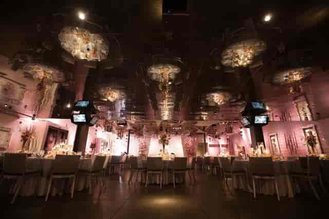 Elegant event venue with ambient lighting, perfect for weddings and upscale gatherings.
