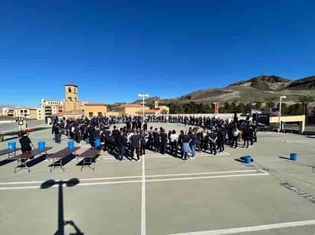 Outdoor corporate retreat at The Arctic Express with blue tables and mountain backdrop.