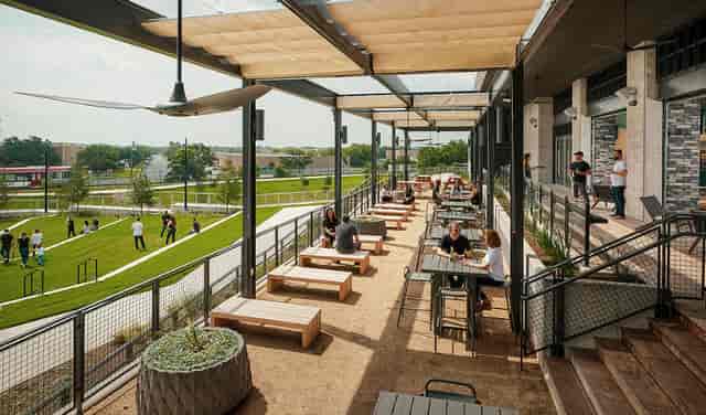 "Outdoor event space at Q2 Stadium with modern seating and lively atmosphere."