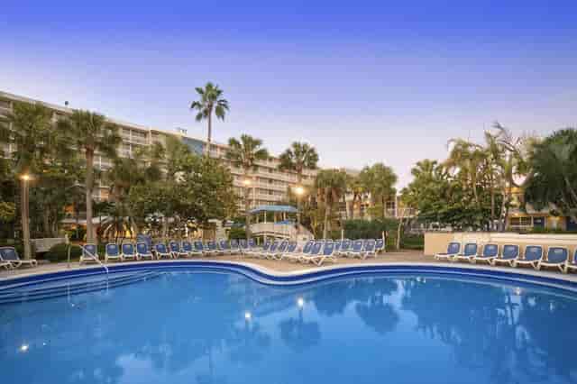 Grand Palm Colonnade pool area at TradeWinds Resort, perfect for networking events and gatherings.