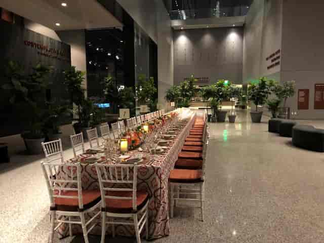 Event setup in Concourse Atrium, NMAAHC with elegant table and inviting ambiance.