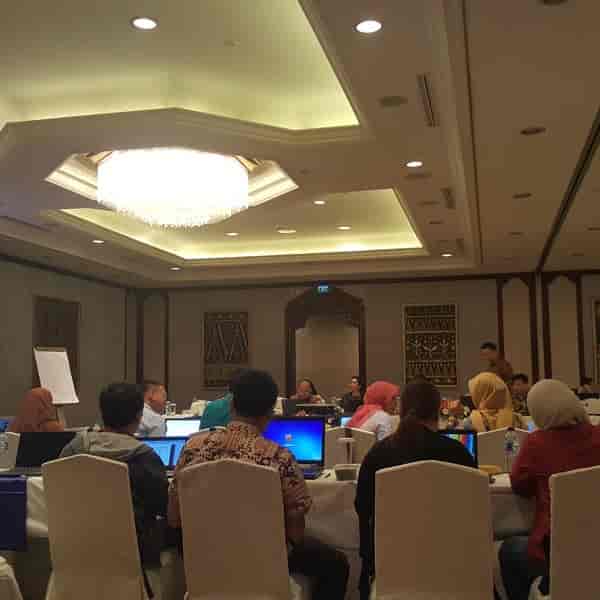 Conference room event in Shangri-La Hotel, Jakarta with laptops and collaborative layout.