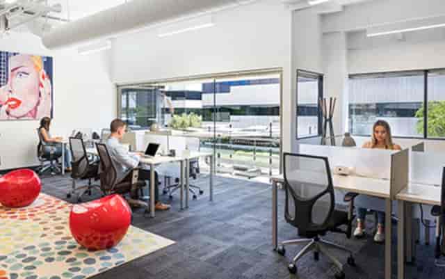 Modern open-concept workspace in Suite 2000, perfect for meetings and collaboration events.