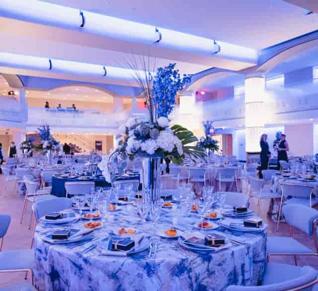 Elegant Hamilton Ballroom banquet hall with floral centerpieces for upscale events.