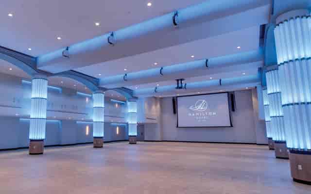 Spacious event venue in The Schuyler with elegant lighting for corporate meetings.