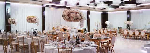 Elegant event hall in Hotel Renaissance, ideal for weddings with stunning floral centerpieces.