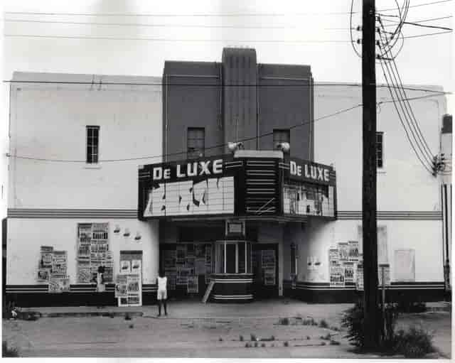 Vintage DeLUXE Theater with art deco facade, ideal for themed events and film screenings.