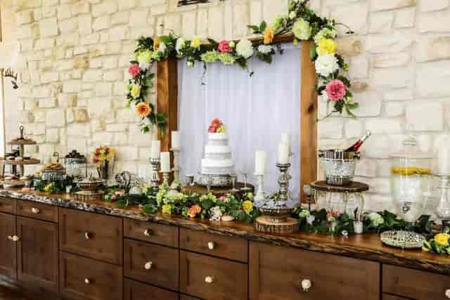Elegant dessert table with tiered cake for wedding at Acadian Event Services.