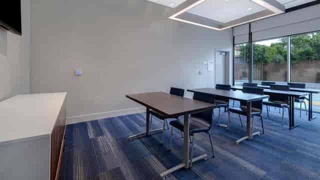 Modern meeting room with natural light for workshops at Holiday Inn Express Glendale.