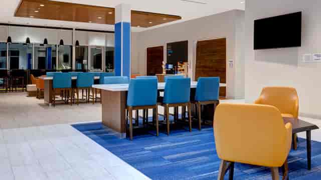 Modern meeting room with vibrant furniture for casual gatherings at Holiday Inn Express Glendale.