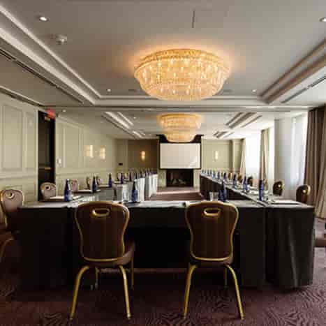 Foxhall Ballroom corporate event setup with elegant chandelier and natural light.