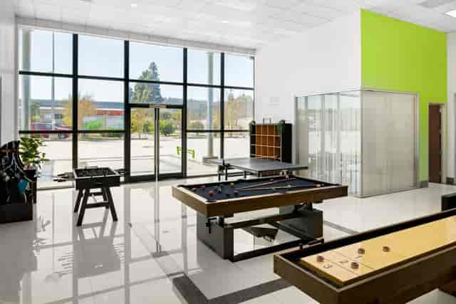 Modern shared workspace in Cubework with recreational amenities for networking events.