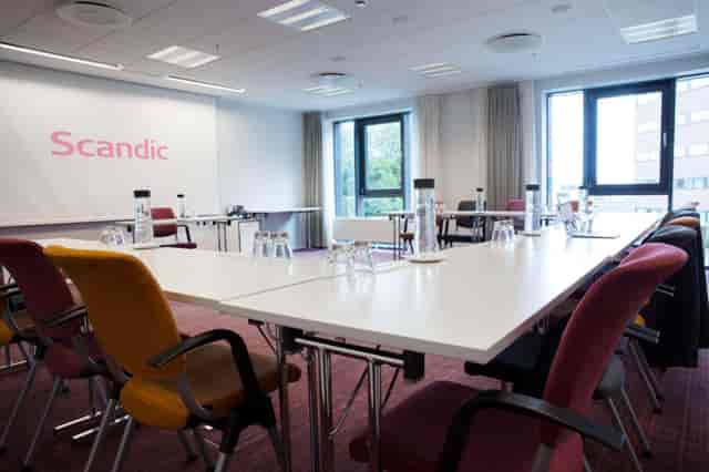 Modern conference room at Scandic Hotels with ergonomic chairs for workshops and presentations.