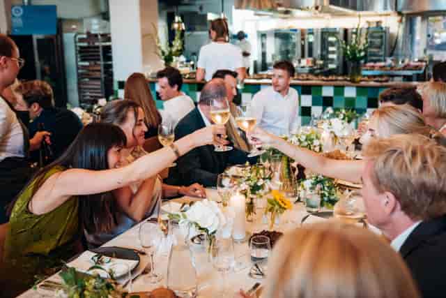 Celebratory restaurant scene with elegant table setting, perfect for networking events.
