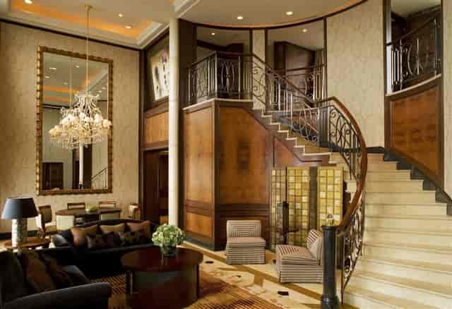 Elegant meeting room with grand staircase at The Hongta Hotel, ideal for corporate events.