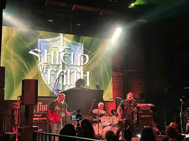 Yost Theater live performance with bold backdrop, perfect for events and networking.