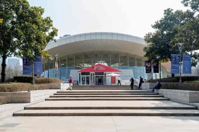 Modern Shanghai Culture Square theatre with sleek glass façade, perfect for events and exhibitions.