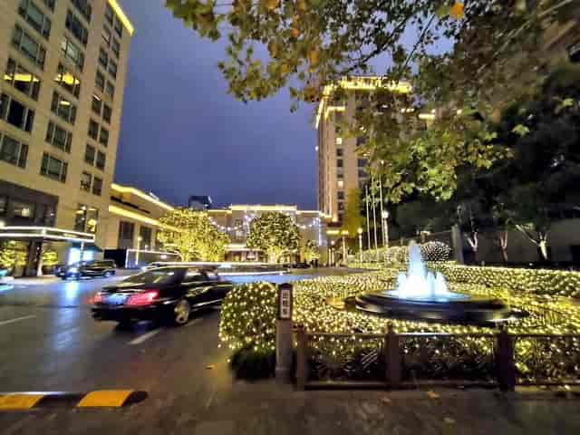 Illuminated venue entrance at Huangpu River for upscale outdoor events.