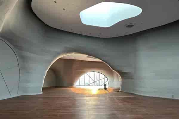 Small event space with organic design and natural light for creative workshops.