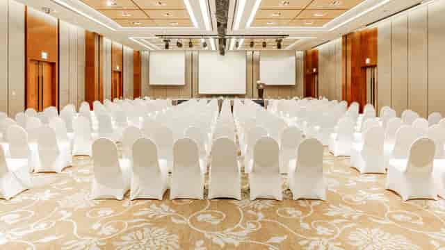 Sapphire Ballroom at LOTTE HOTEL WORLD set for a professional conference with white chairs.