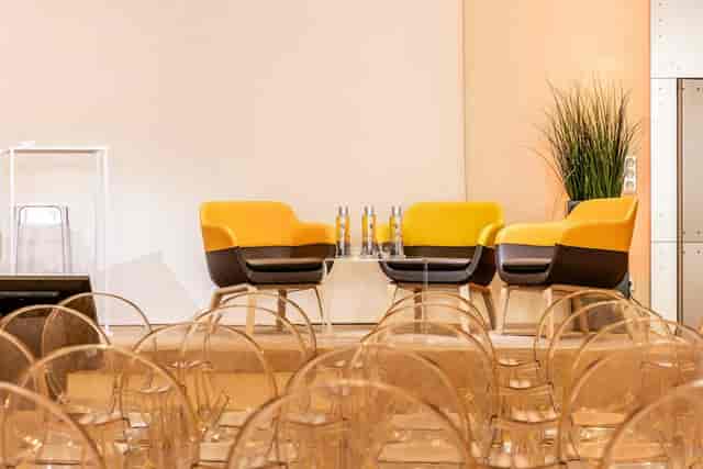 Modern event space at Salon De La Vaulx with stylish seating for panels and discussions.